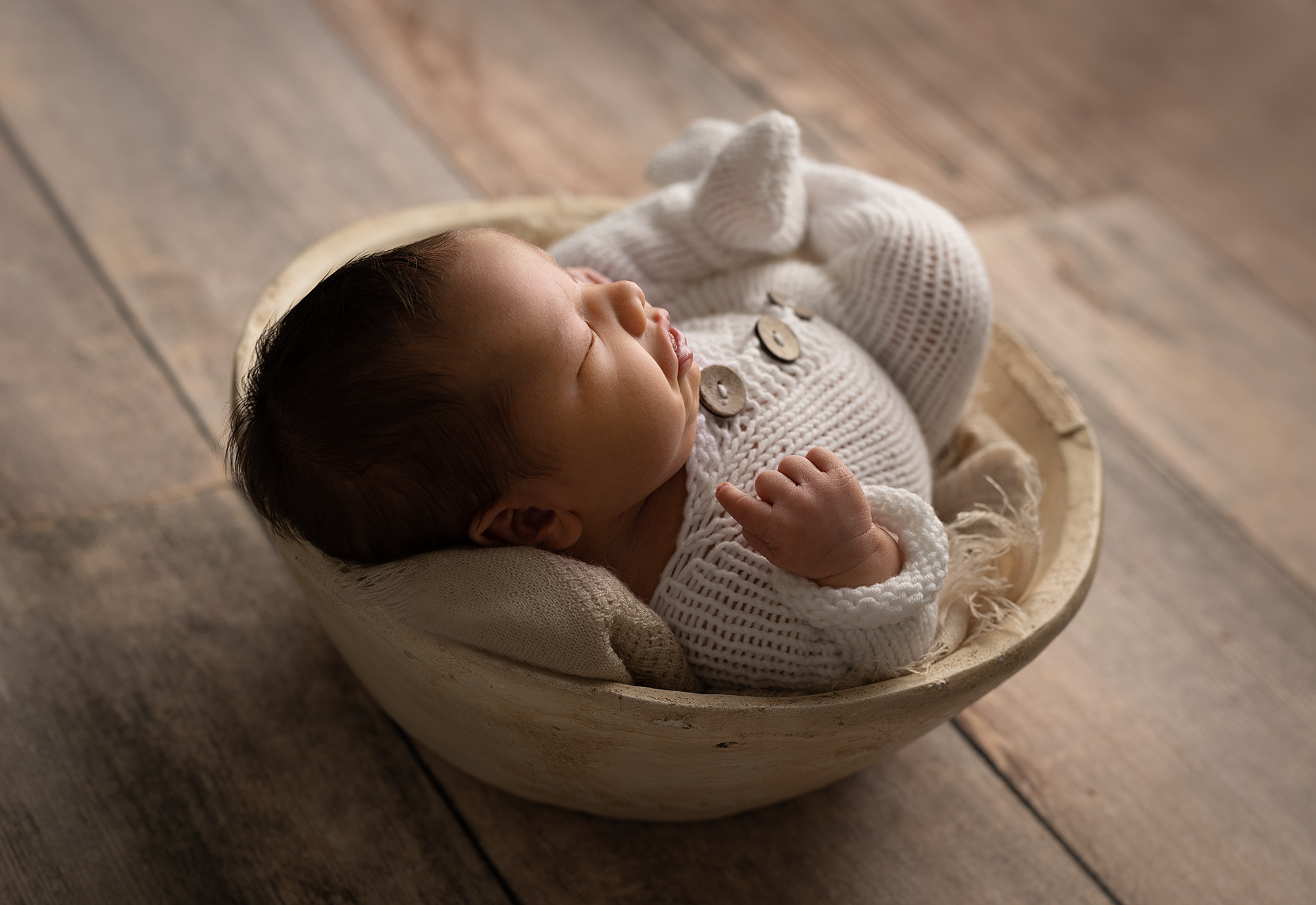 Photo Of A Baby Sleeping On A Bucket