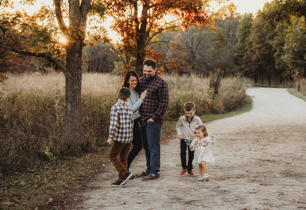Family sharing a candid moment together during an outdoor session at Cuba Marsh Forest Preserve in Deer Park, Illinois.
