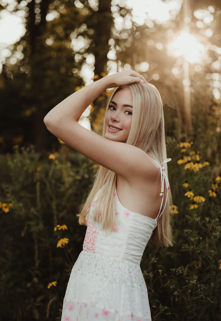 Central High School senior girl in a floral dress during golden hour at Fabyan Forest Preserve in Geneva, IL