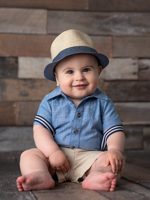 Cute Baby Wearing A Hat and A Shirt Pant